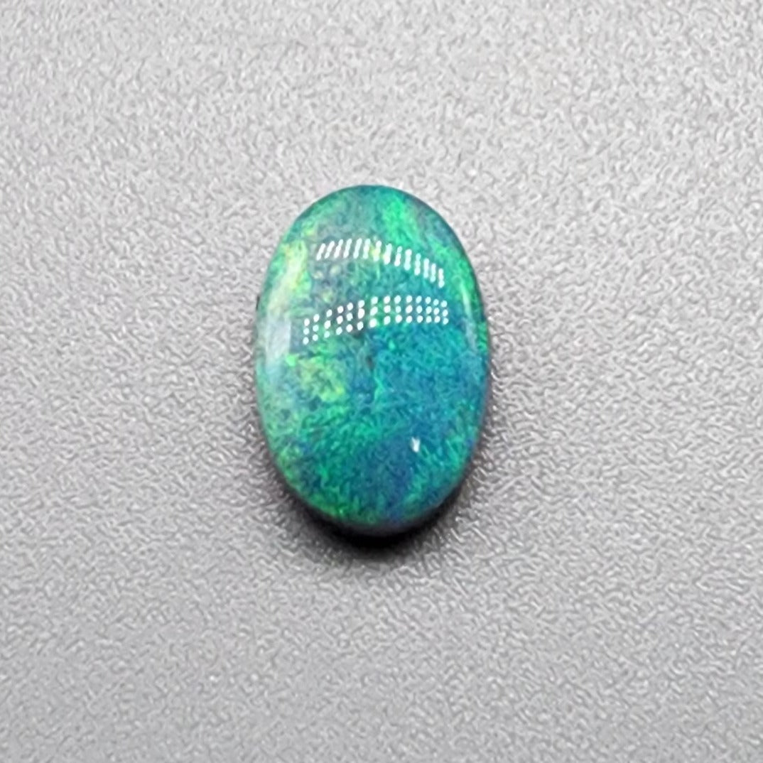 1.76cts  black Opal with a mossy teal color pallet