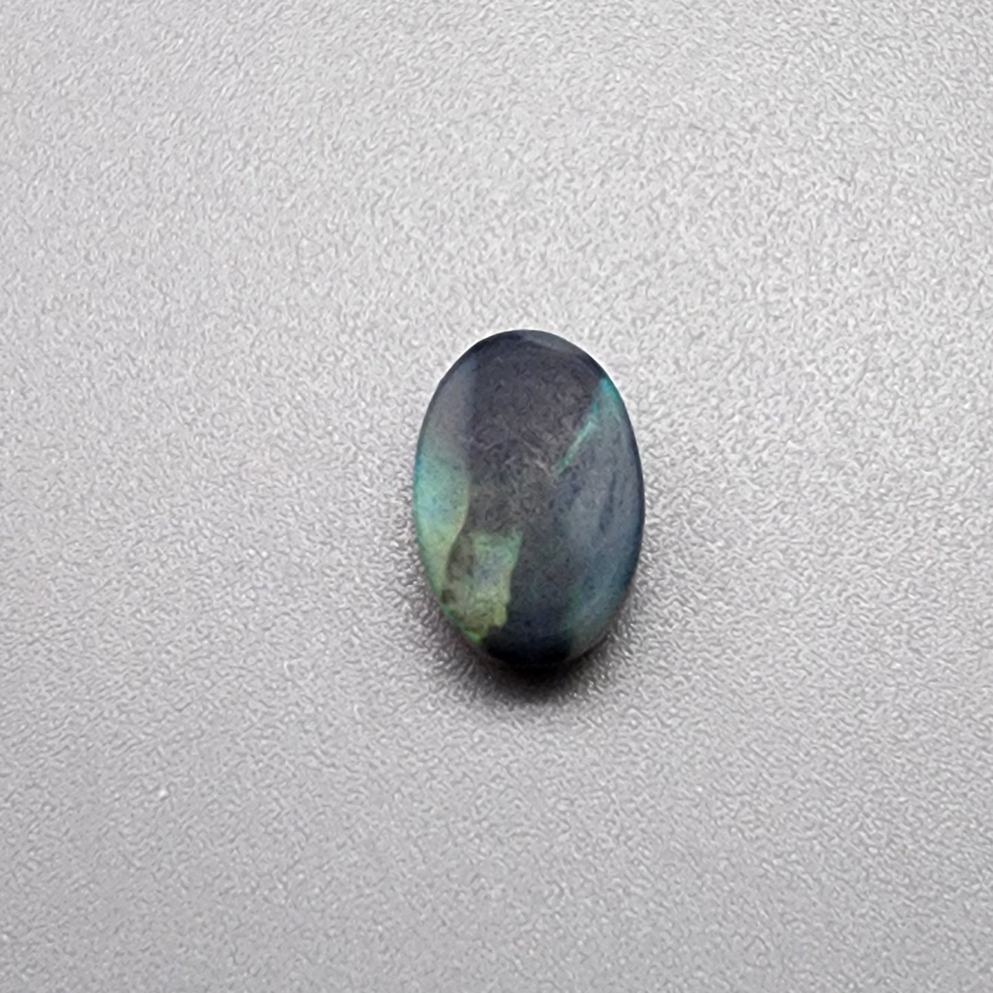 1.76cts  black Opal with a mossy teal color pallet