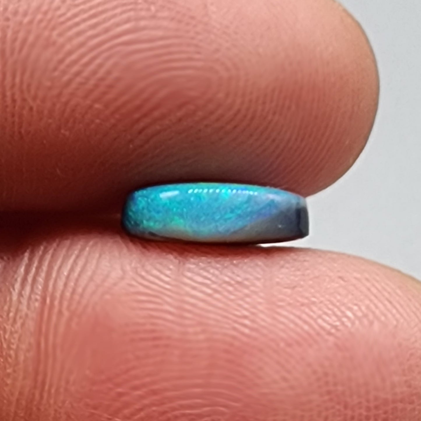 1.76cts  black Opal with a mossy teal color pallet