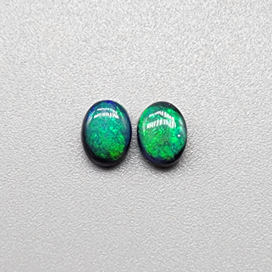 0.70 black Opal pair with a Vivid green mossy pattern