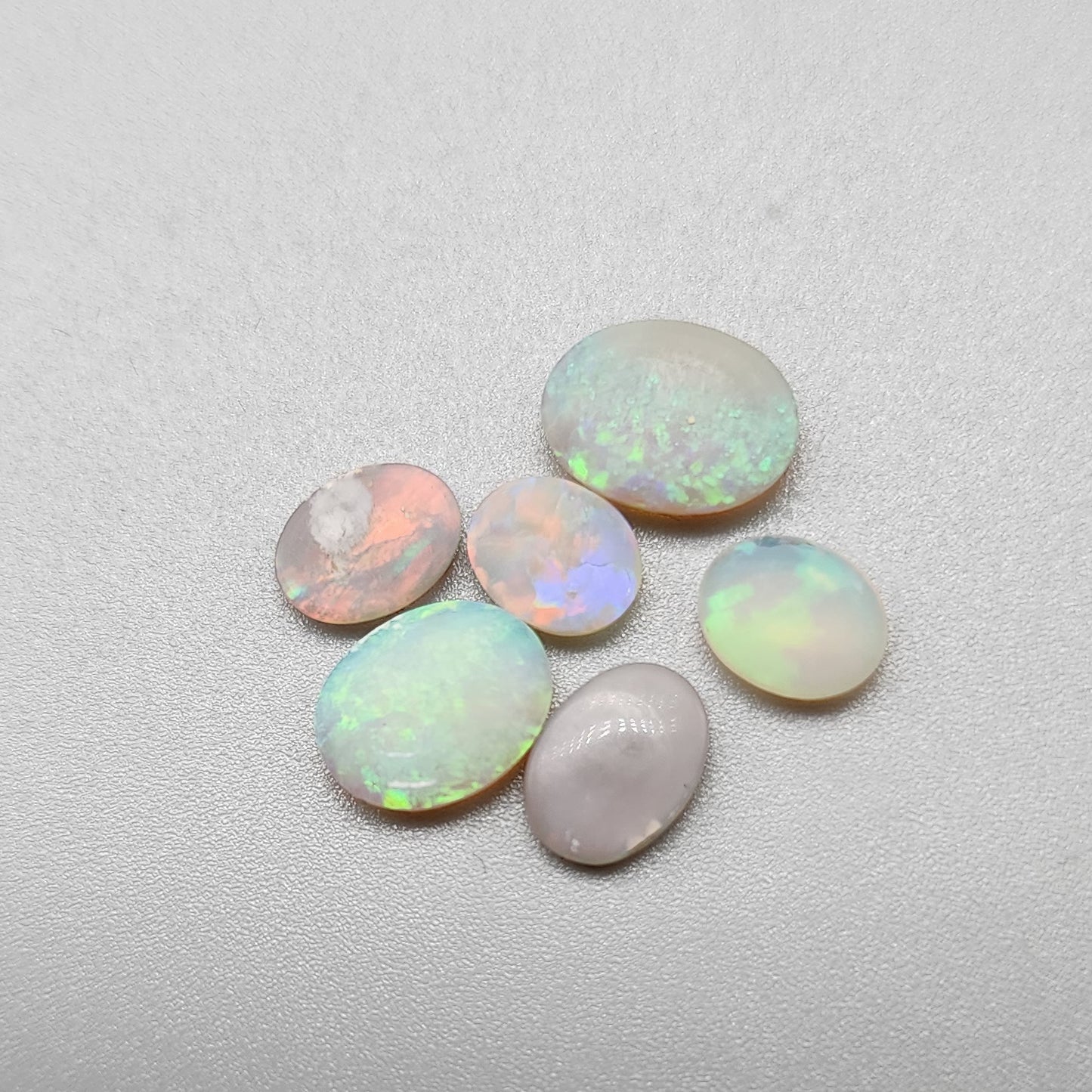 Assortment of crystal and dark opals