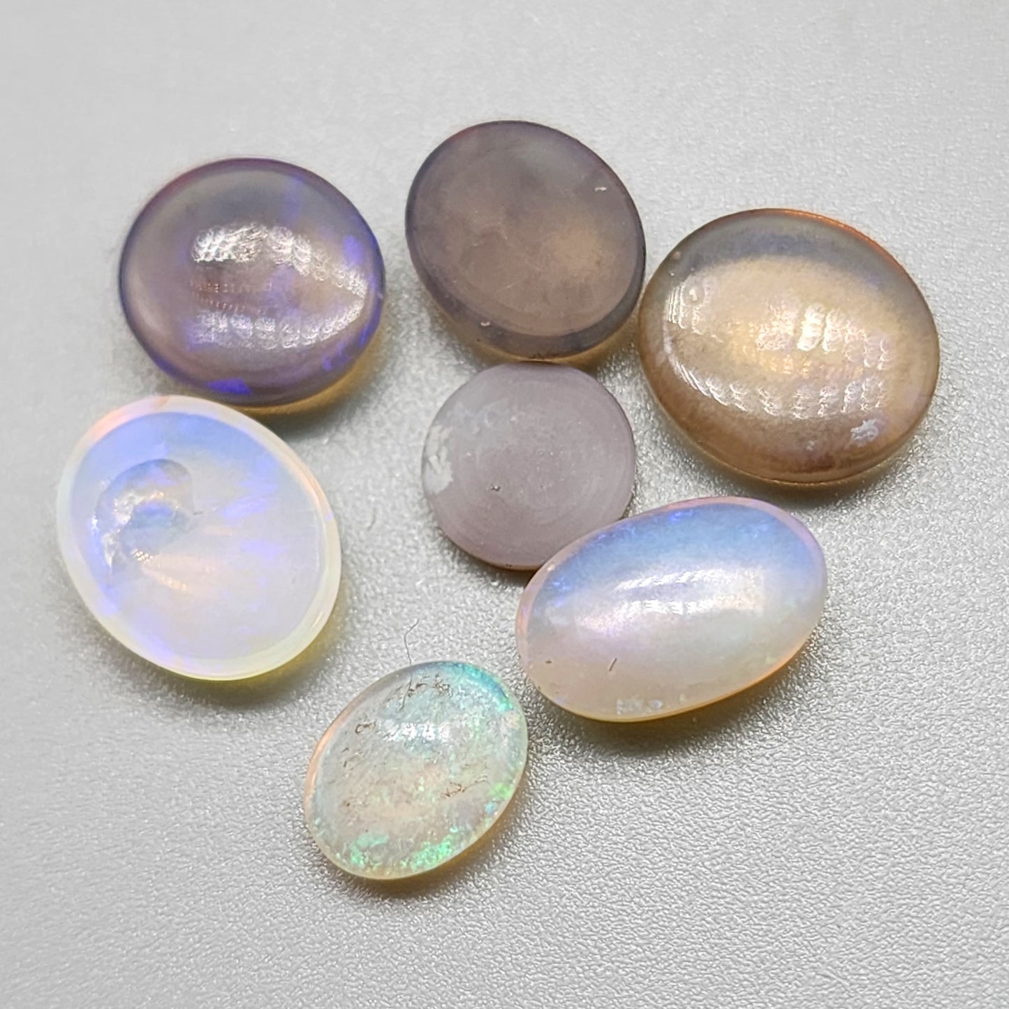 Assortment of crystal and black opals