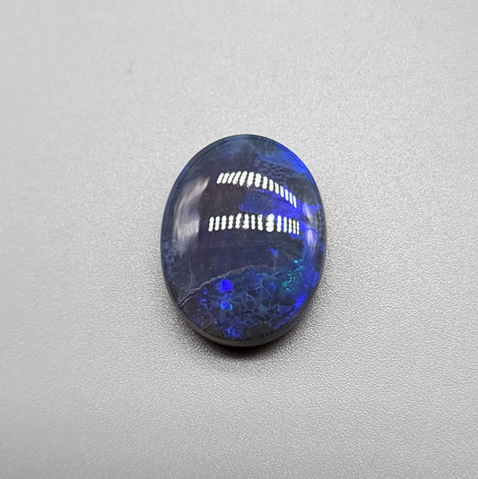 Large 11.40cts black Crystal opal  with a dark blue color palette