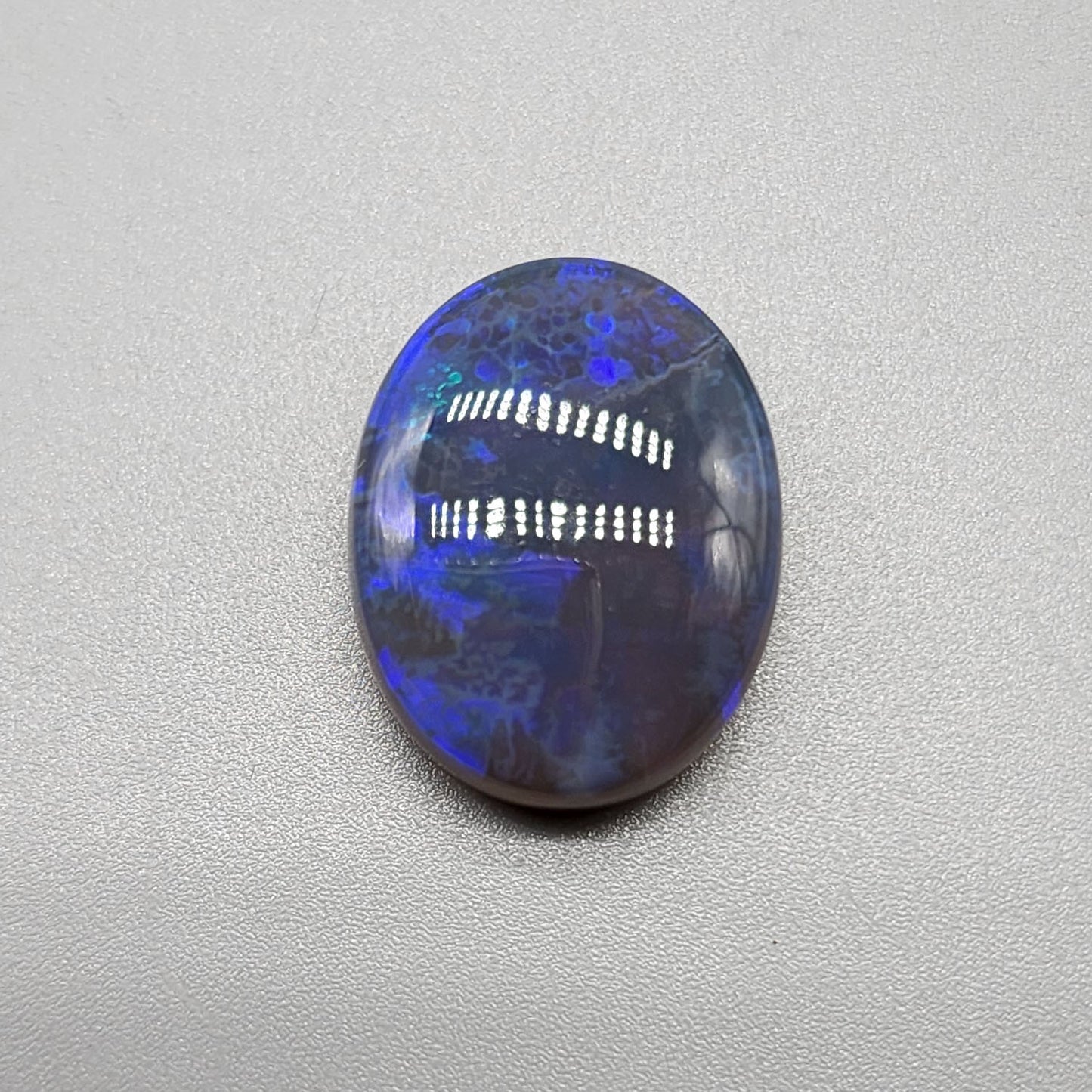 Large 11.40cts black Crystal opal  with a dark blue color palette