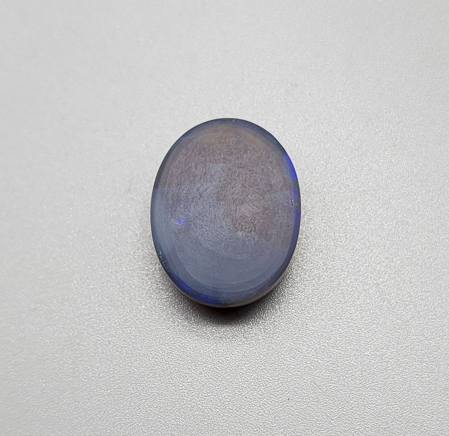 Large 11.40cts black Crystal opal  with a dark blue color palette