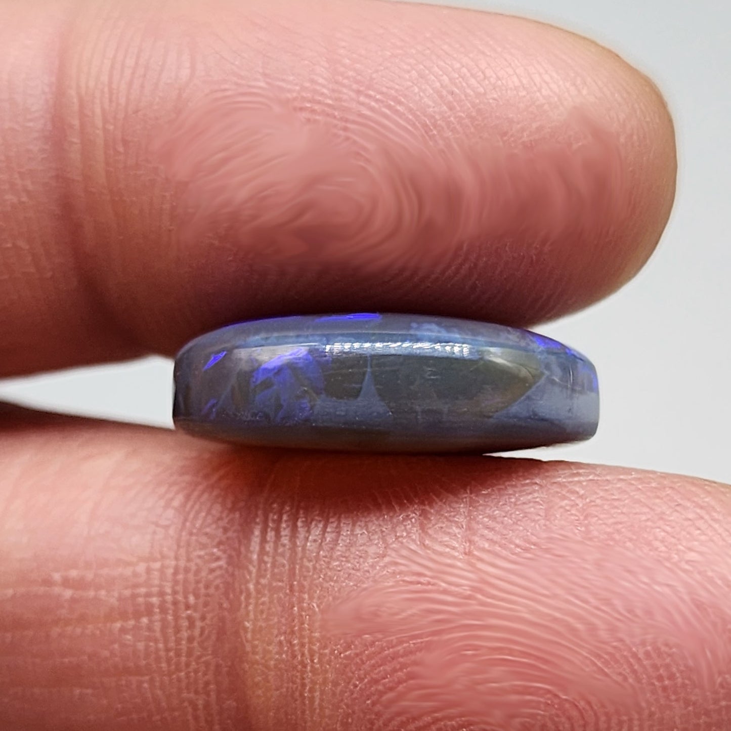 Large 11.40cts black Crystal opal  with a dark blue color palette