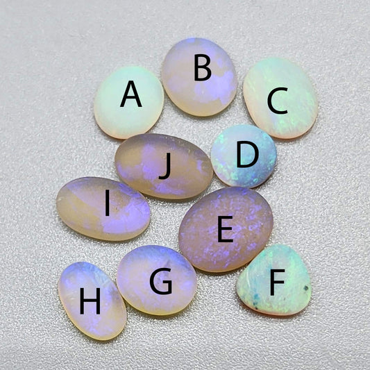 Assorted Matte Crystal opals, with a sea glass like look and soft glow of pastel colors