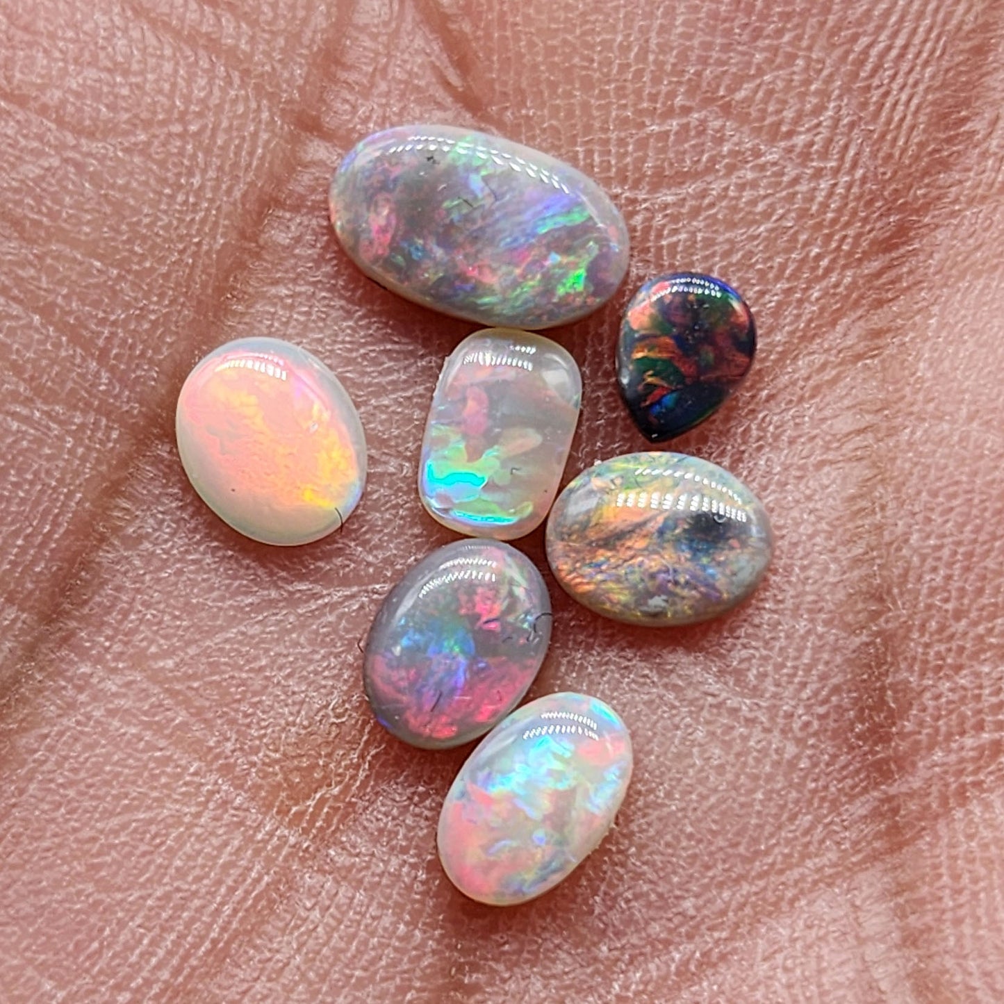 Assorted Black and Dark opals with warm, sunset color palettes