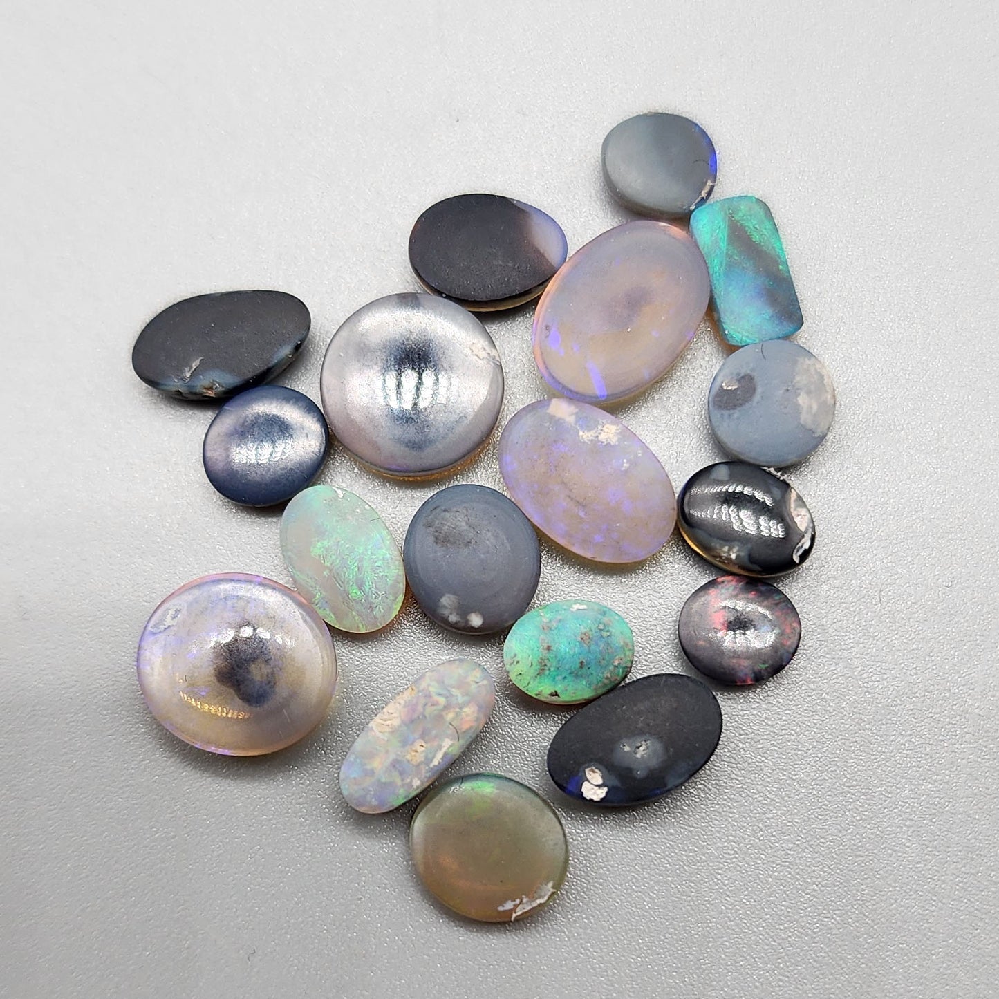 Assorted Crystal, Semi Black and Black Opals with textural color palettes