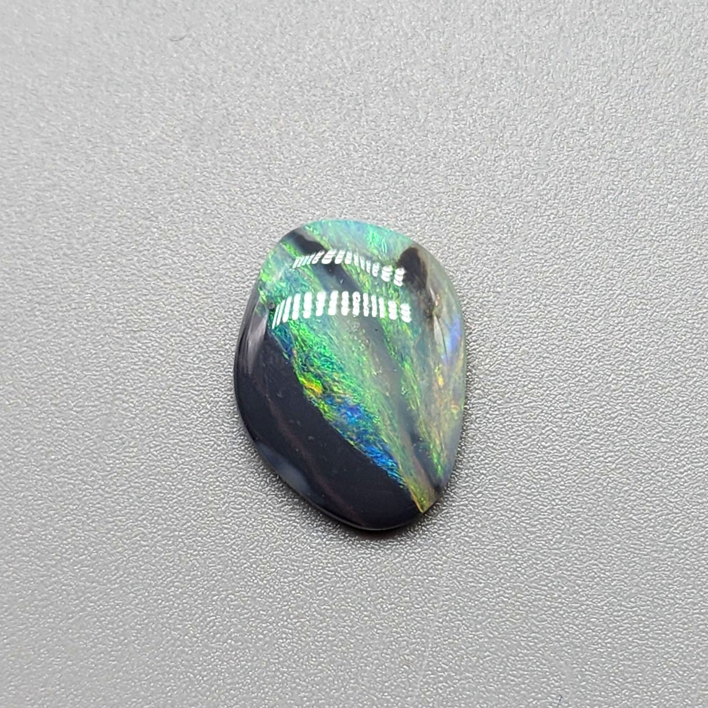 2.9ct Black Opal with a marbling of green and charcoal black