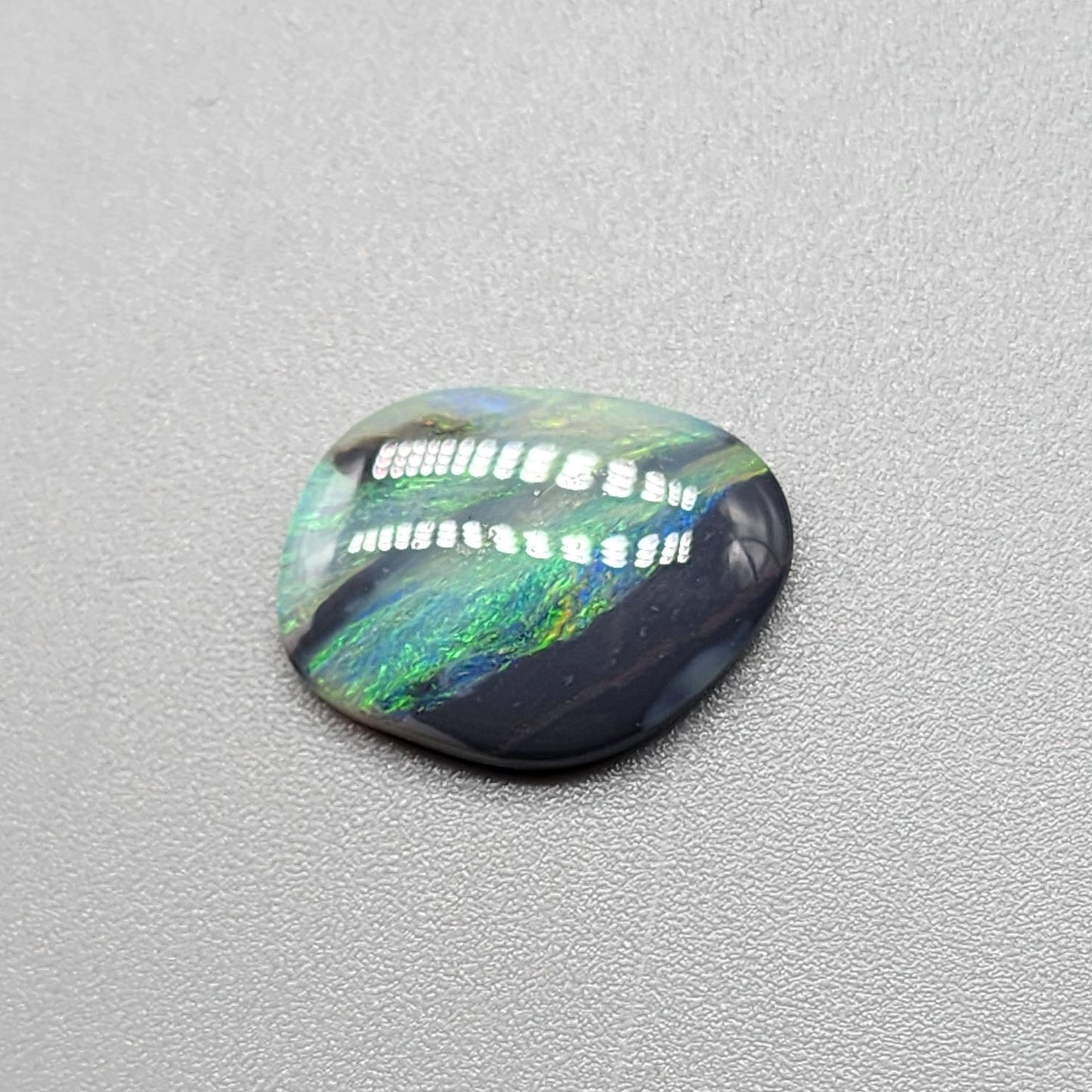 2.9ct Black Opal with a marbling of green and charcoal black