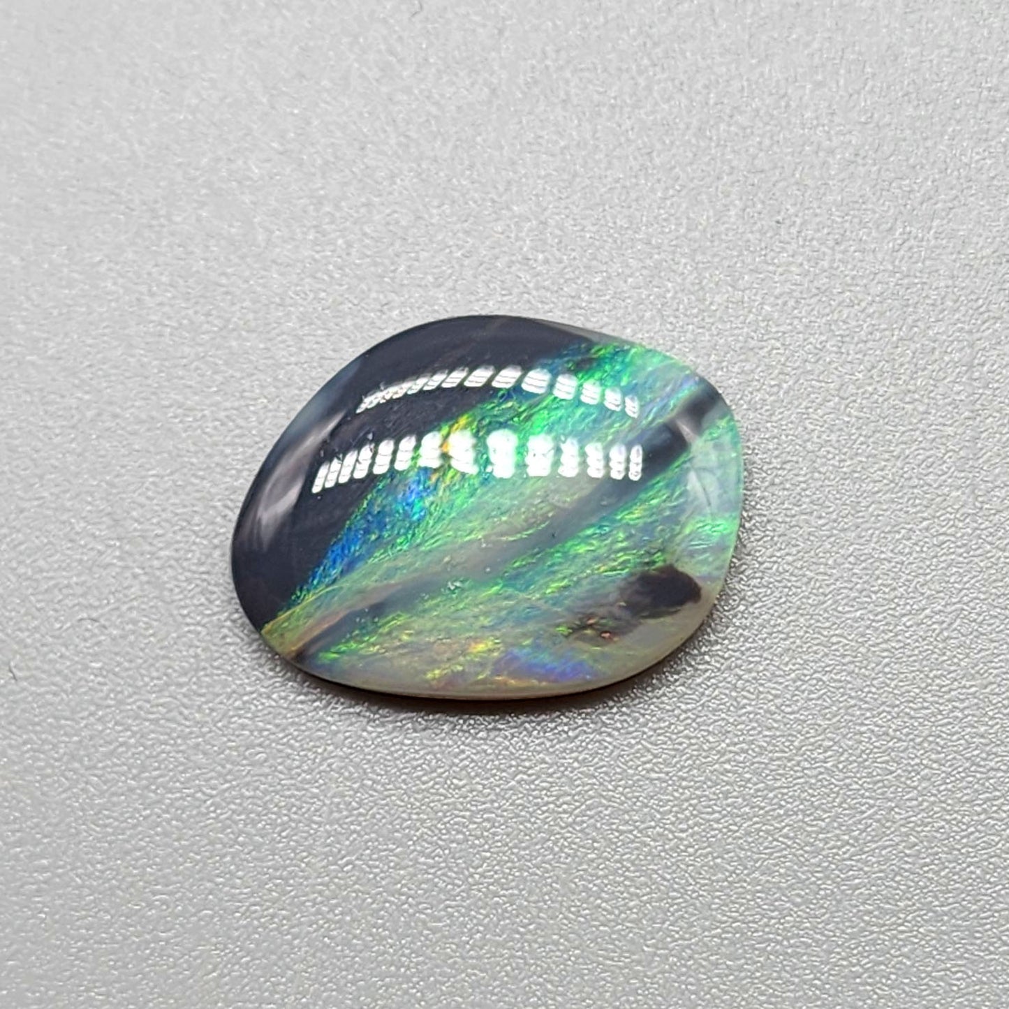 2.9ct Black Opal with a marbling of green and charcoal black