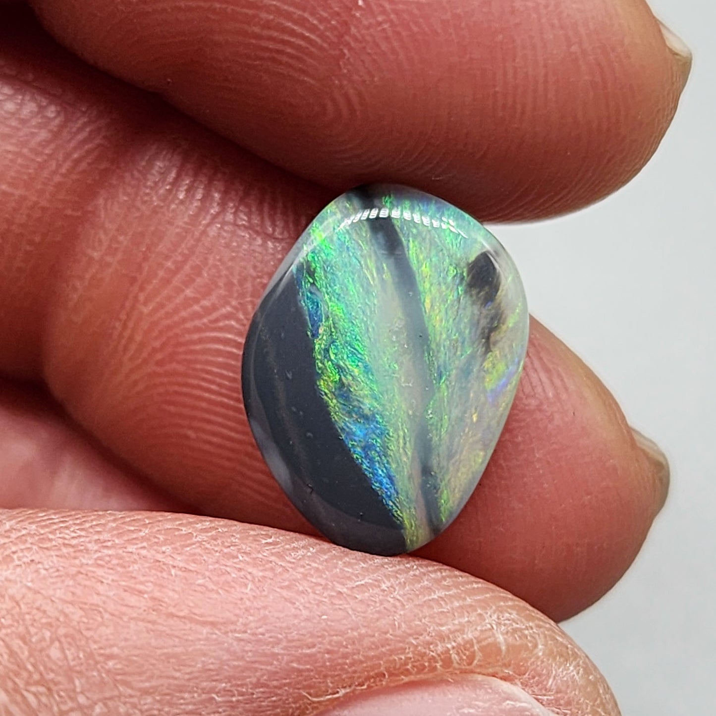 2.9ct Black Opal with a marbling of green and charcoal black