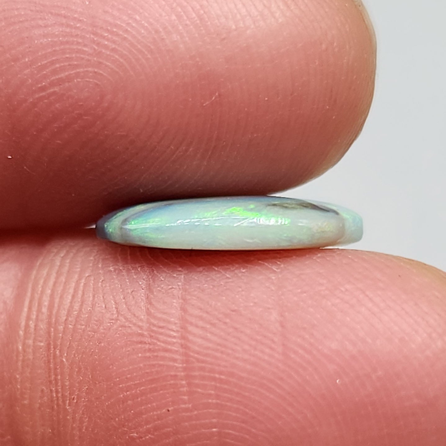 2.9ct Black Opal with a marbling of green and charcoal black