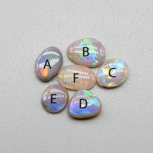 Assortment of dark opals with lovely pastel color palette