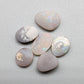 Assortment of dark opals with lovely pastel color palette