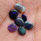 Assortment of black opals with marbling of color and potch