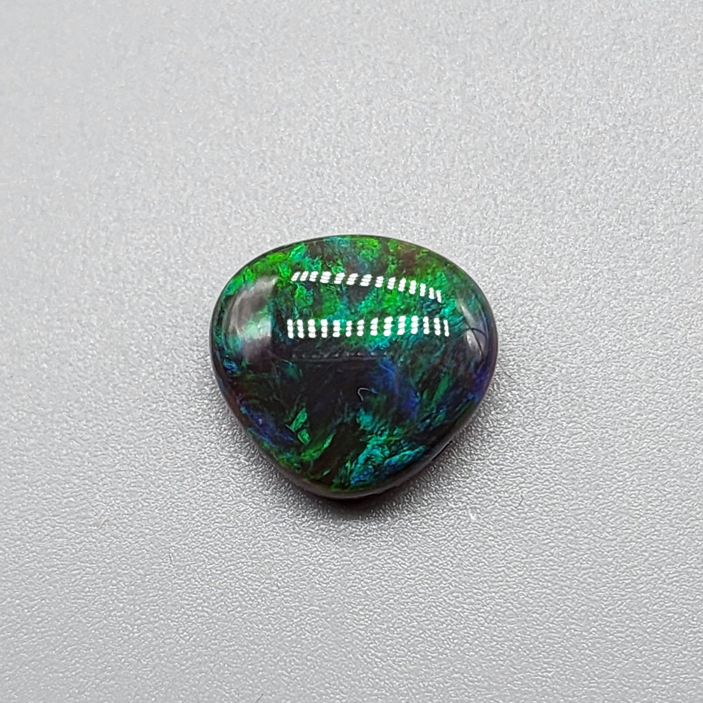 5.4cts Black Opal with rich forest green and hints of teal