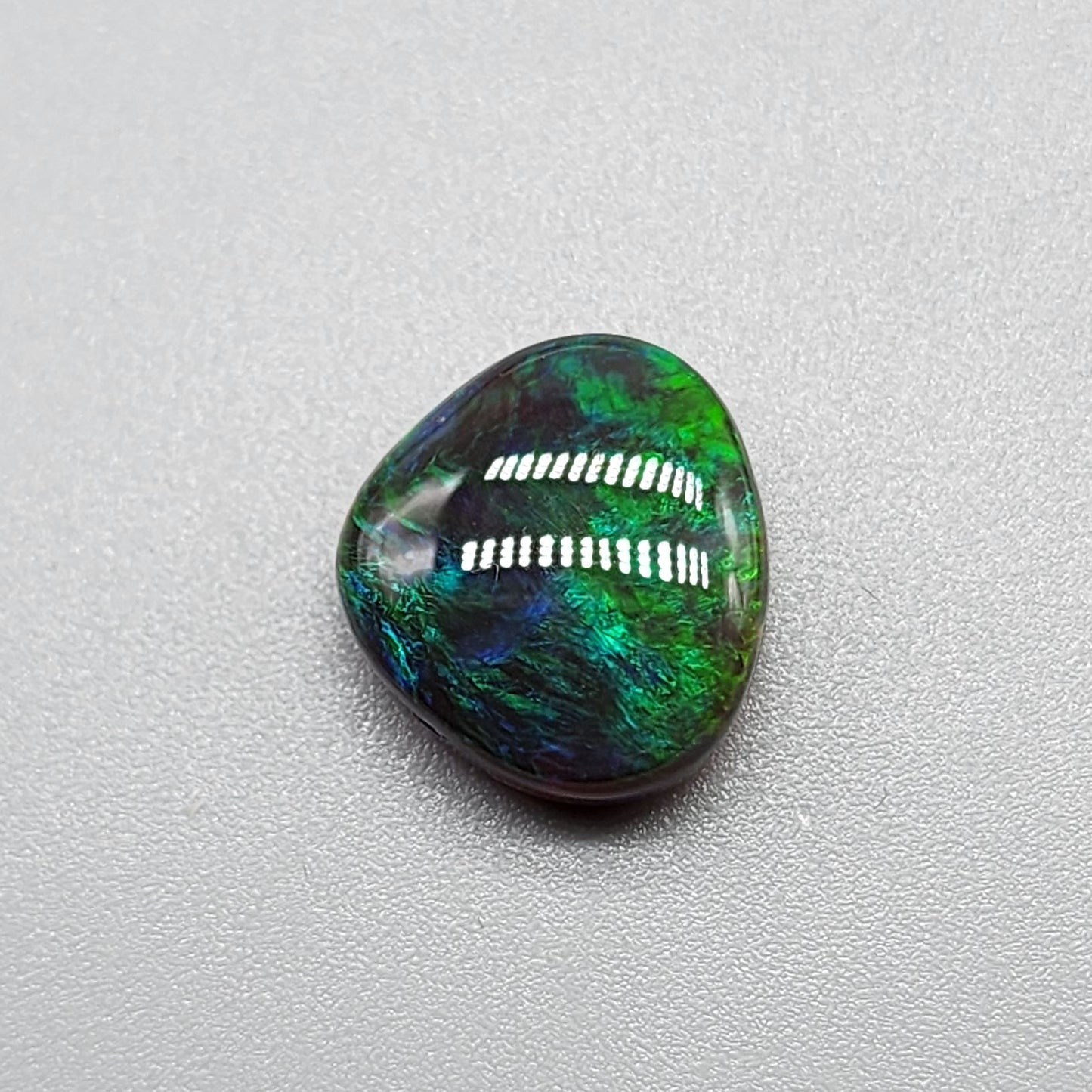 5.4cts Black Opal with rich forest green and hints of teal