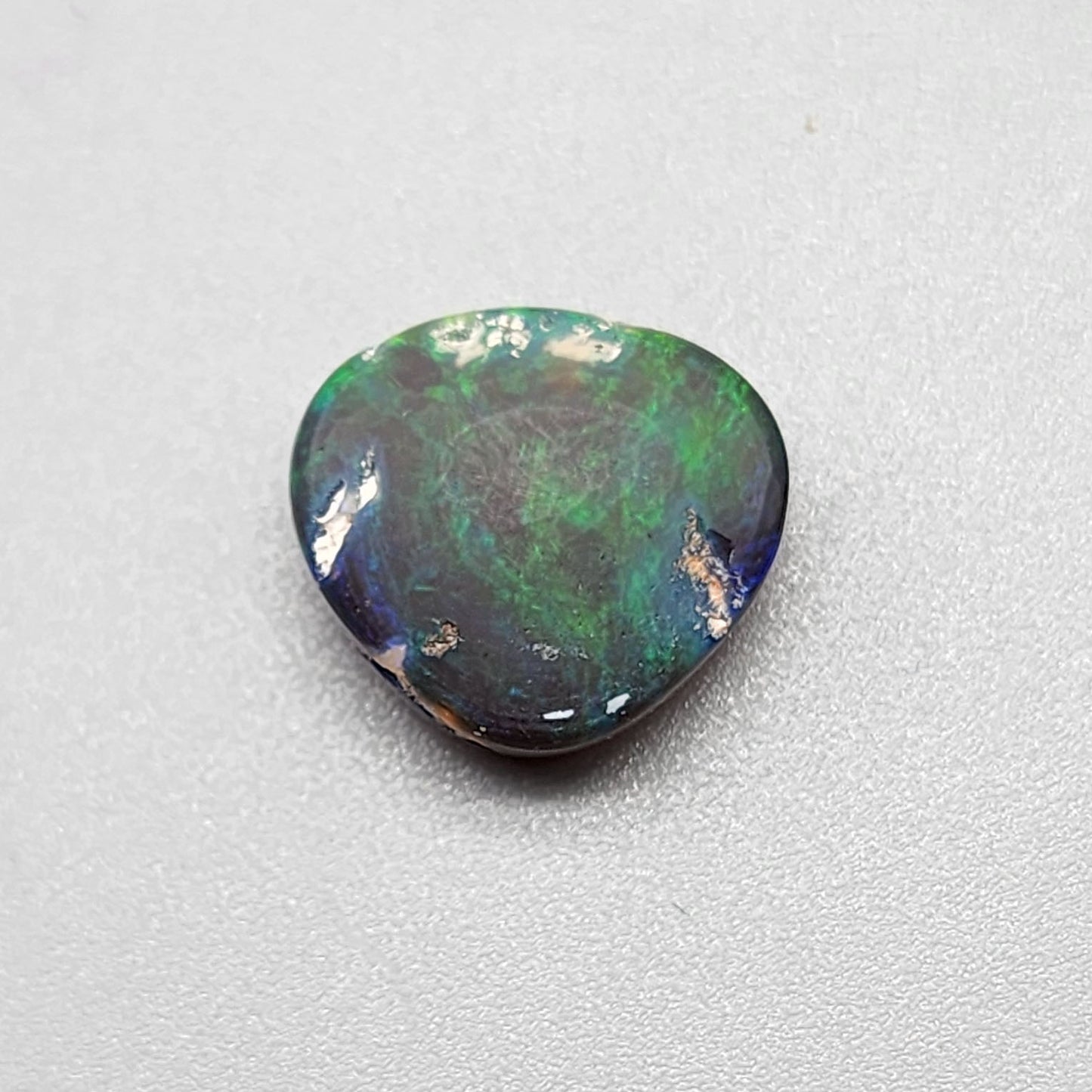 5.4cts Black Opal with rich forest green and hints of teal