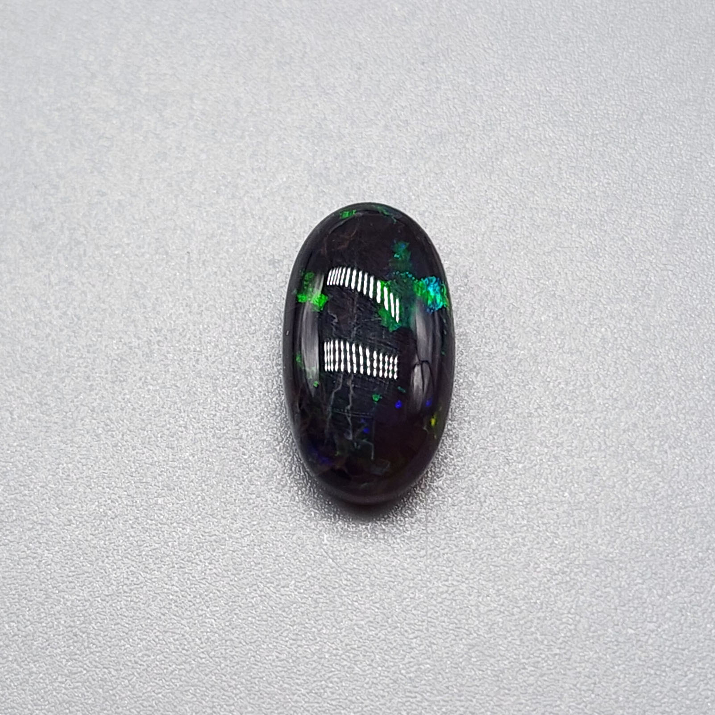 3.5cts black Opal with rare forest green pattern