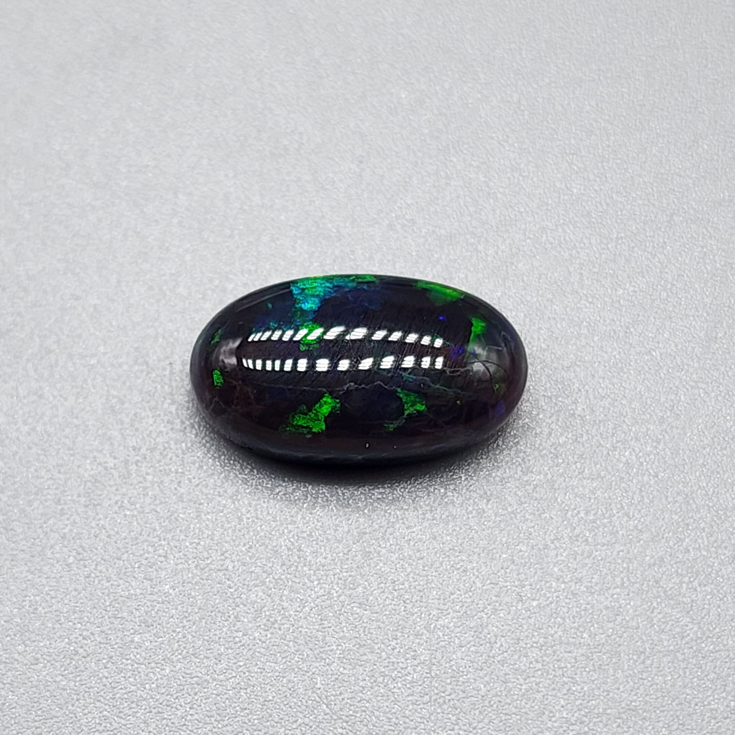 3.5cts black Opal with rare forest green pattern