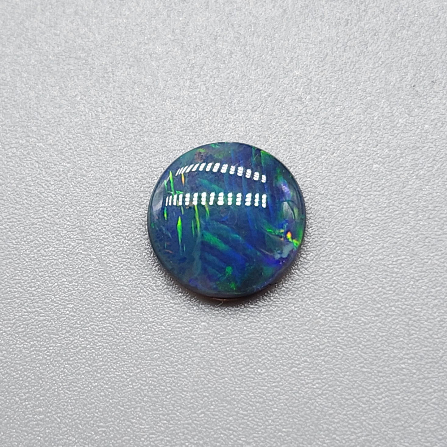 1.1cts black Opal with  Rare straw patter