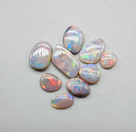 Assortment of dark opals with sunset color pallets