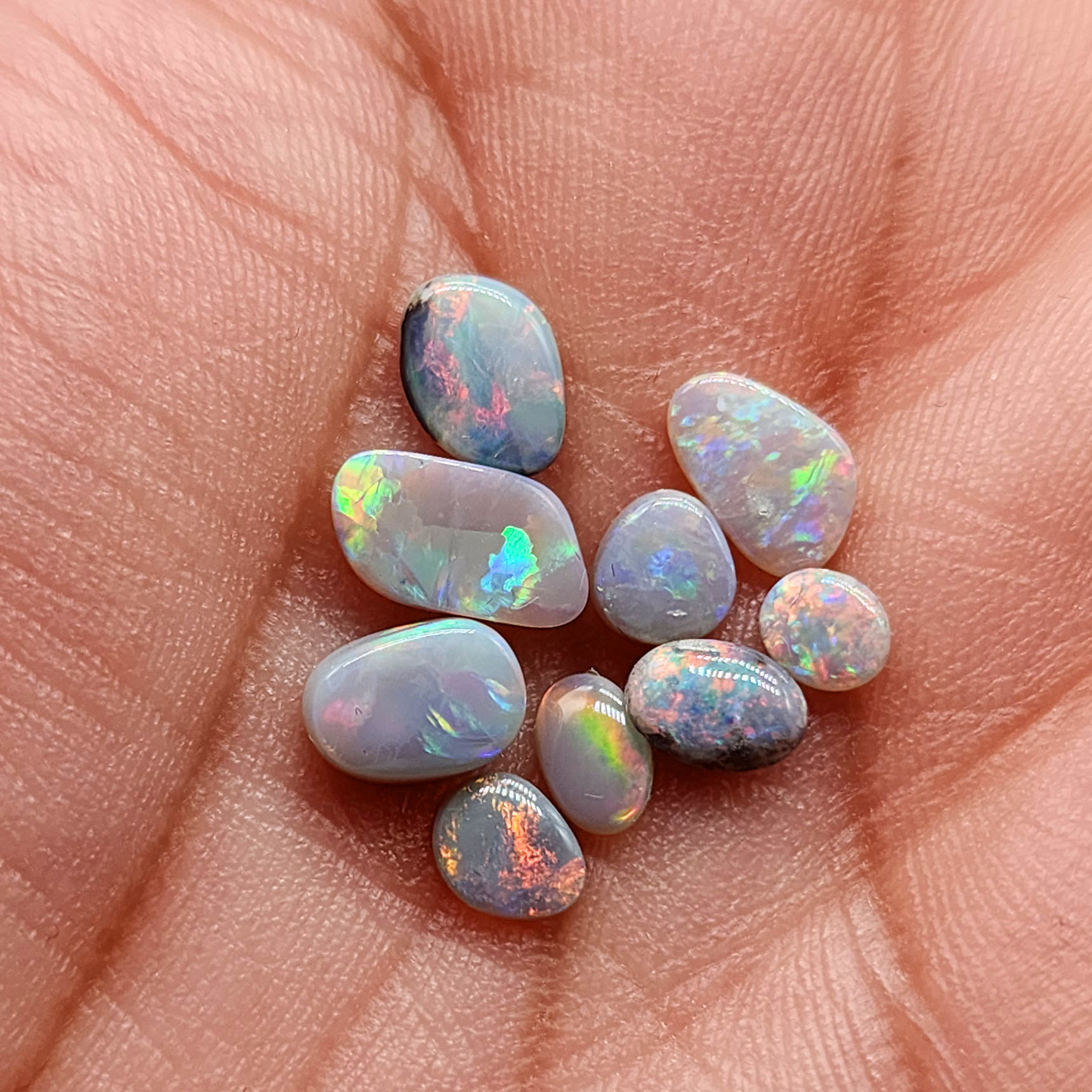 Assortment of dark opals with sunset color pallets