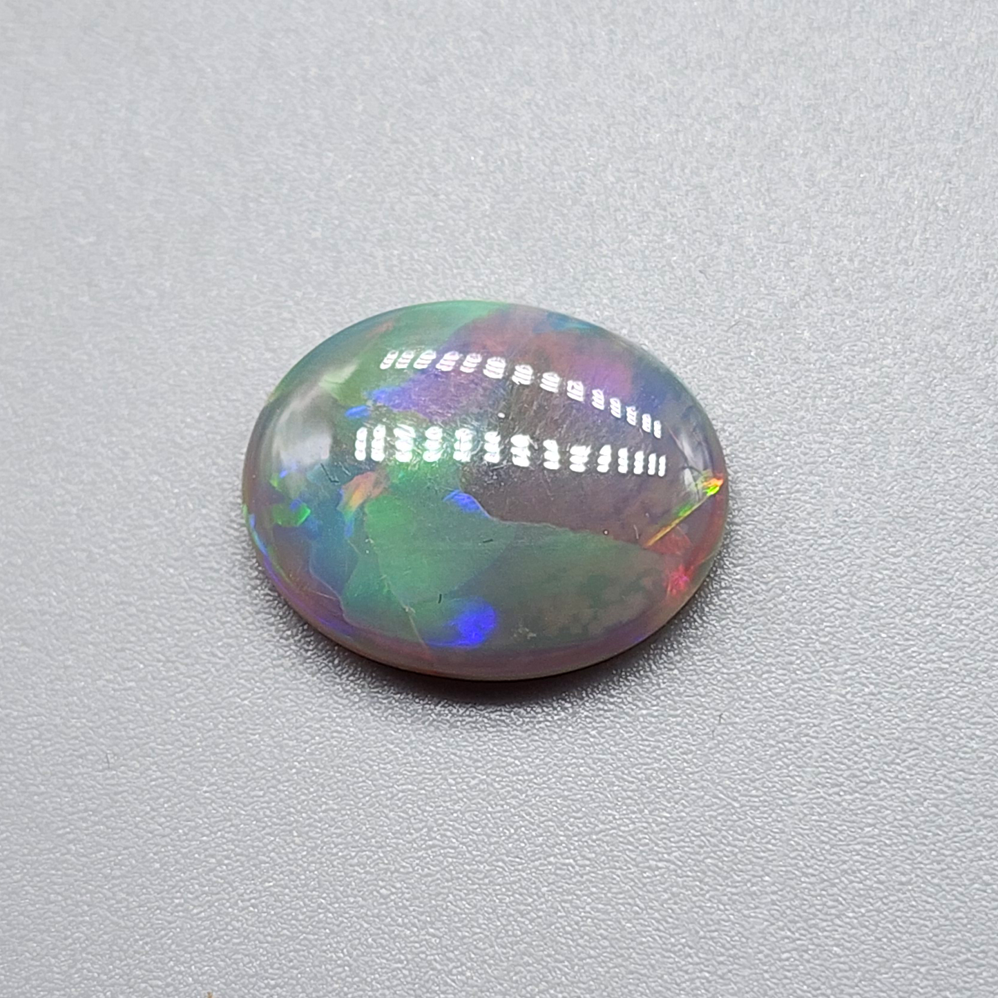 4.2cts Dark Opal with directional but vivid rolling color play