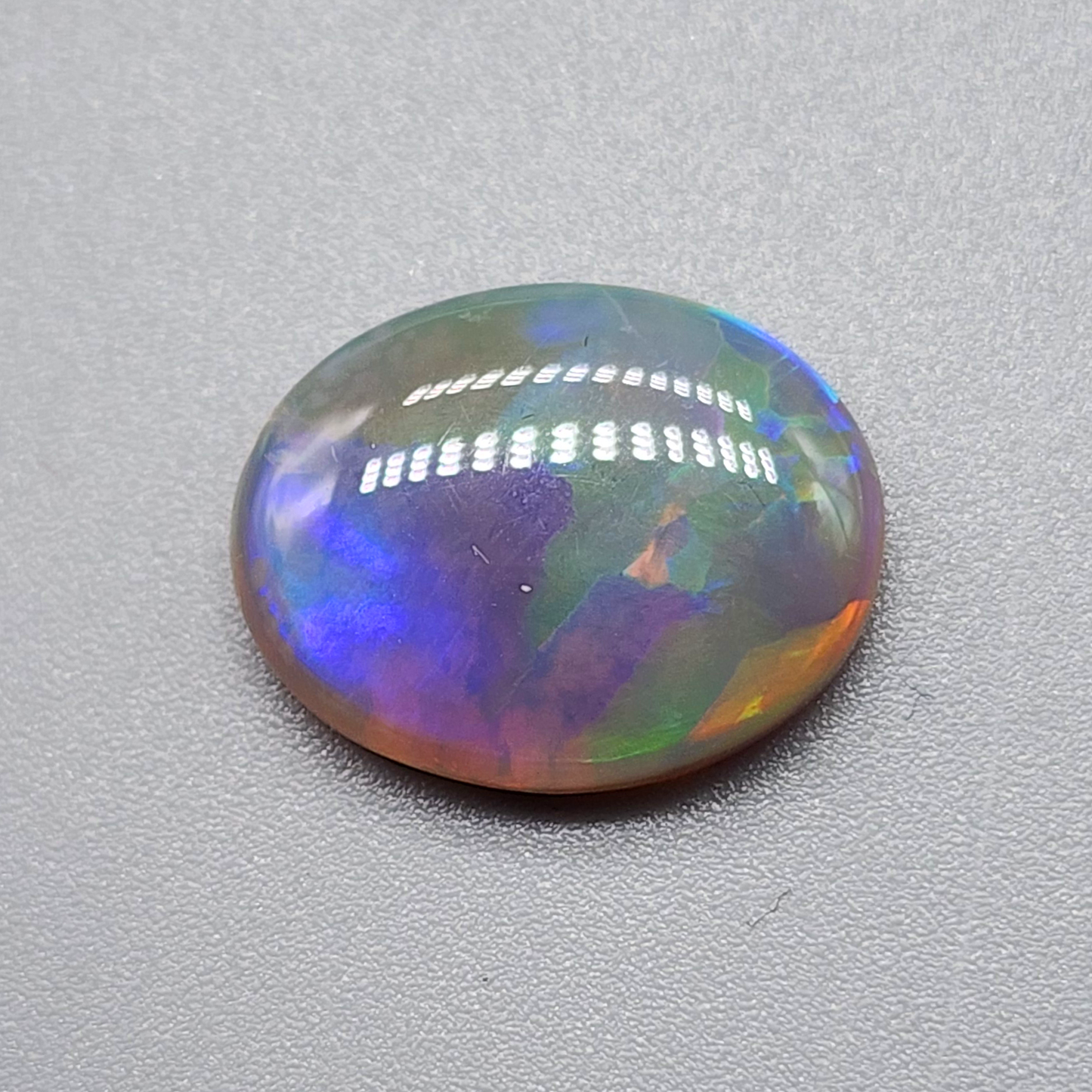 4.2cts Dark Opal with directional but vivid rolling color play