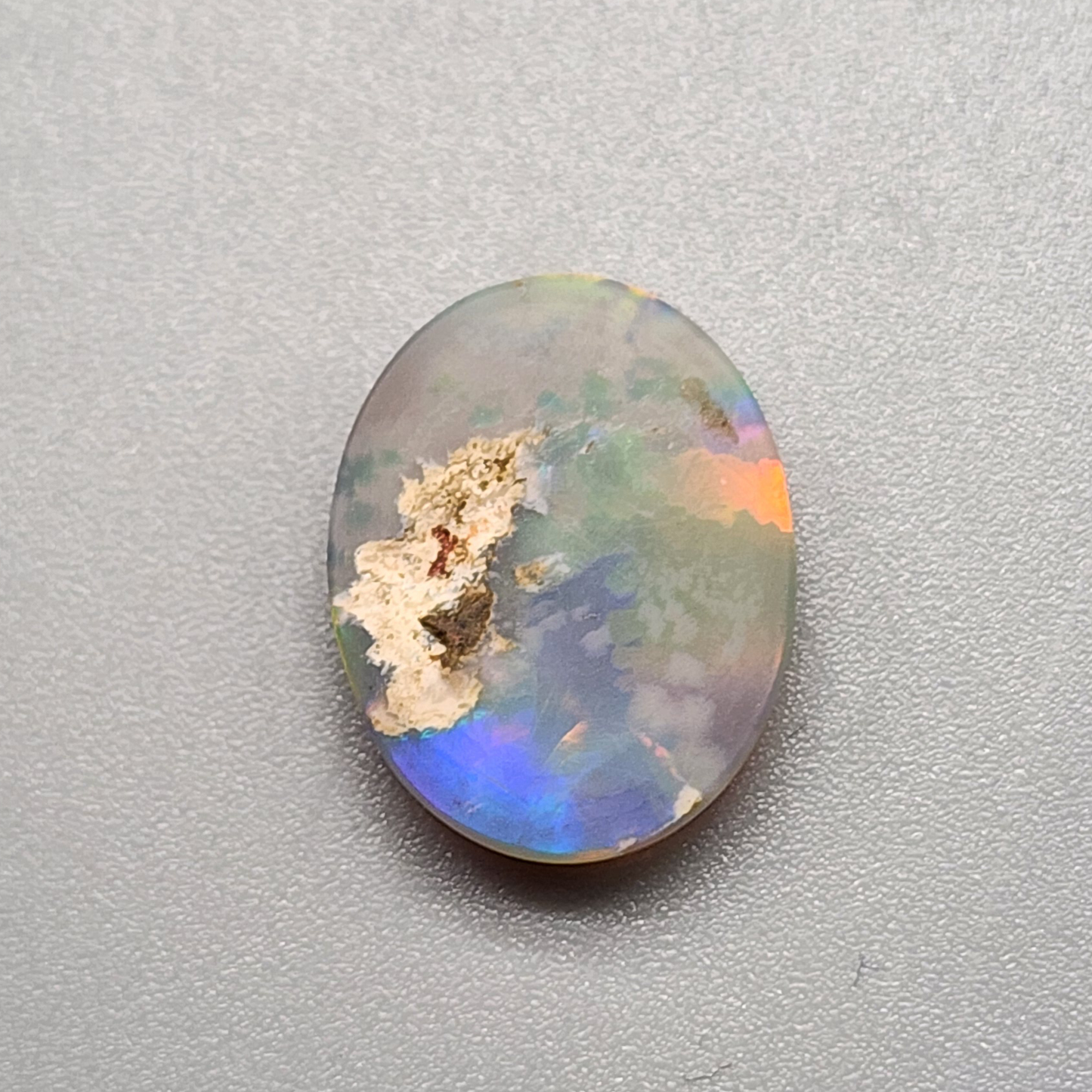 4.2cts Dark Opal with directional but vivid rolling color play