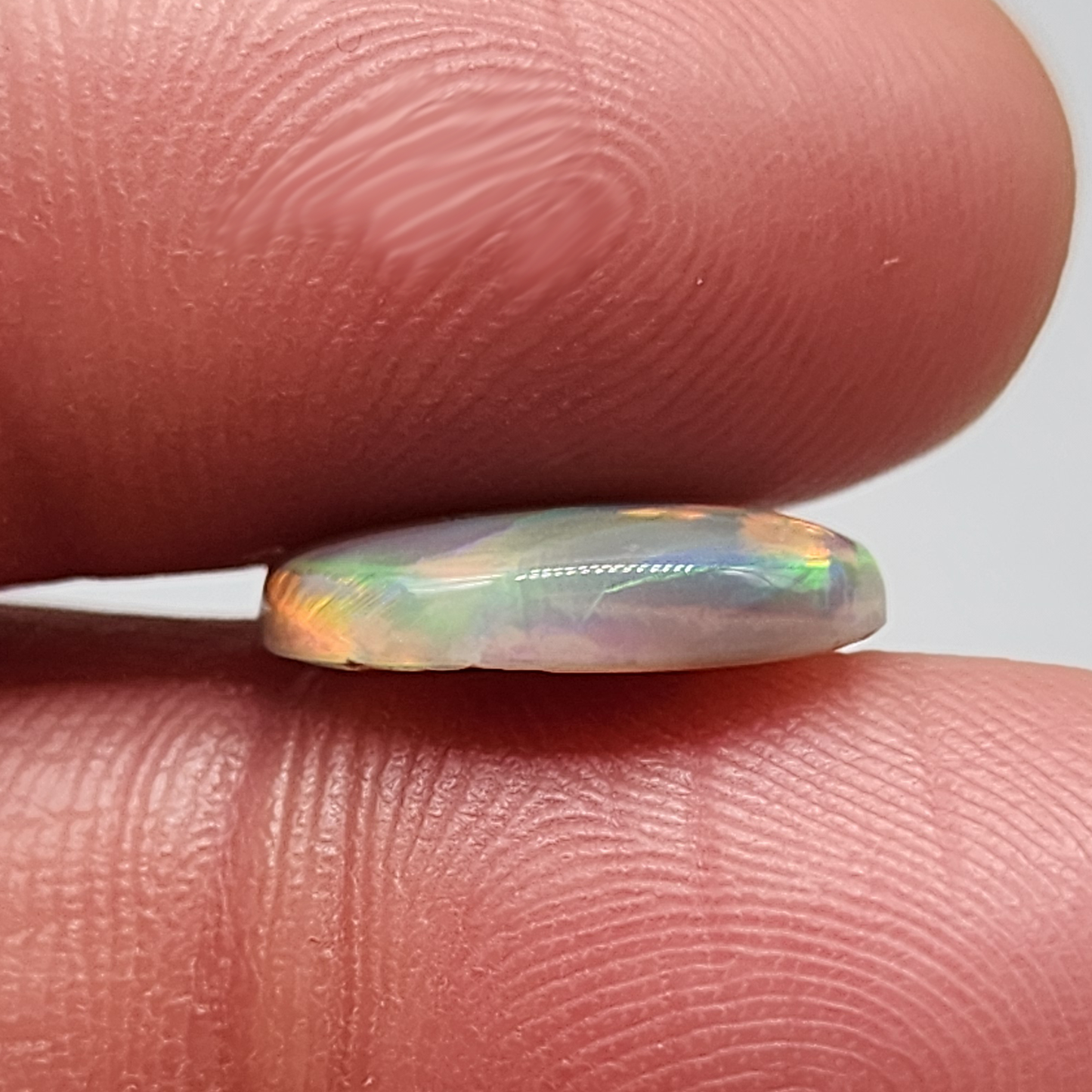 4.2cts Dark Opal with directional but vivid rolling color play