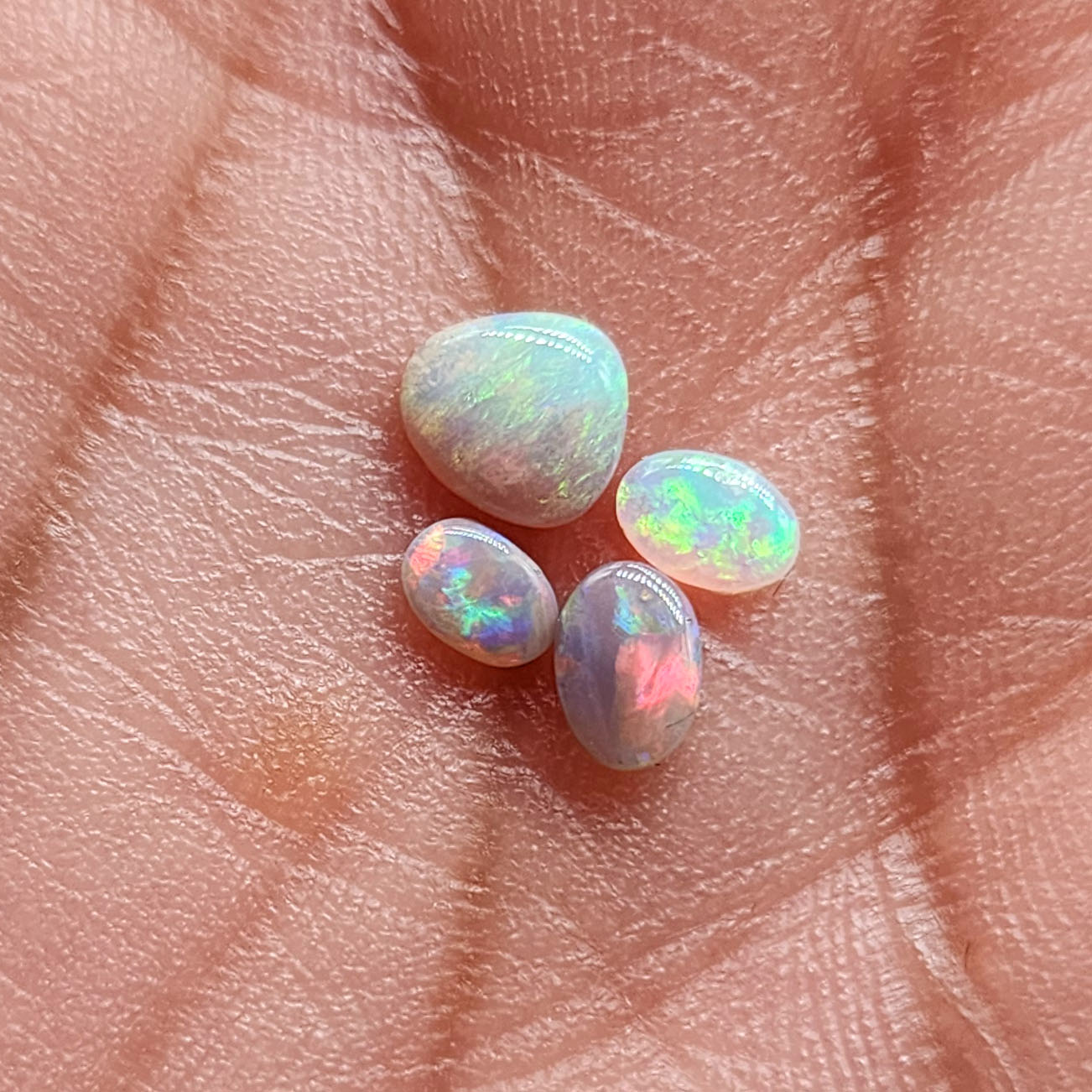 Assortment of dark, and crystal  opals