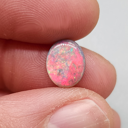 1.5cts Dark Opal with vivid pinkls and flecks of green