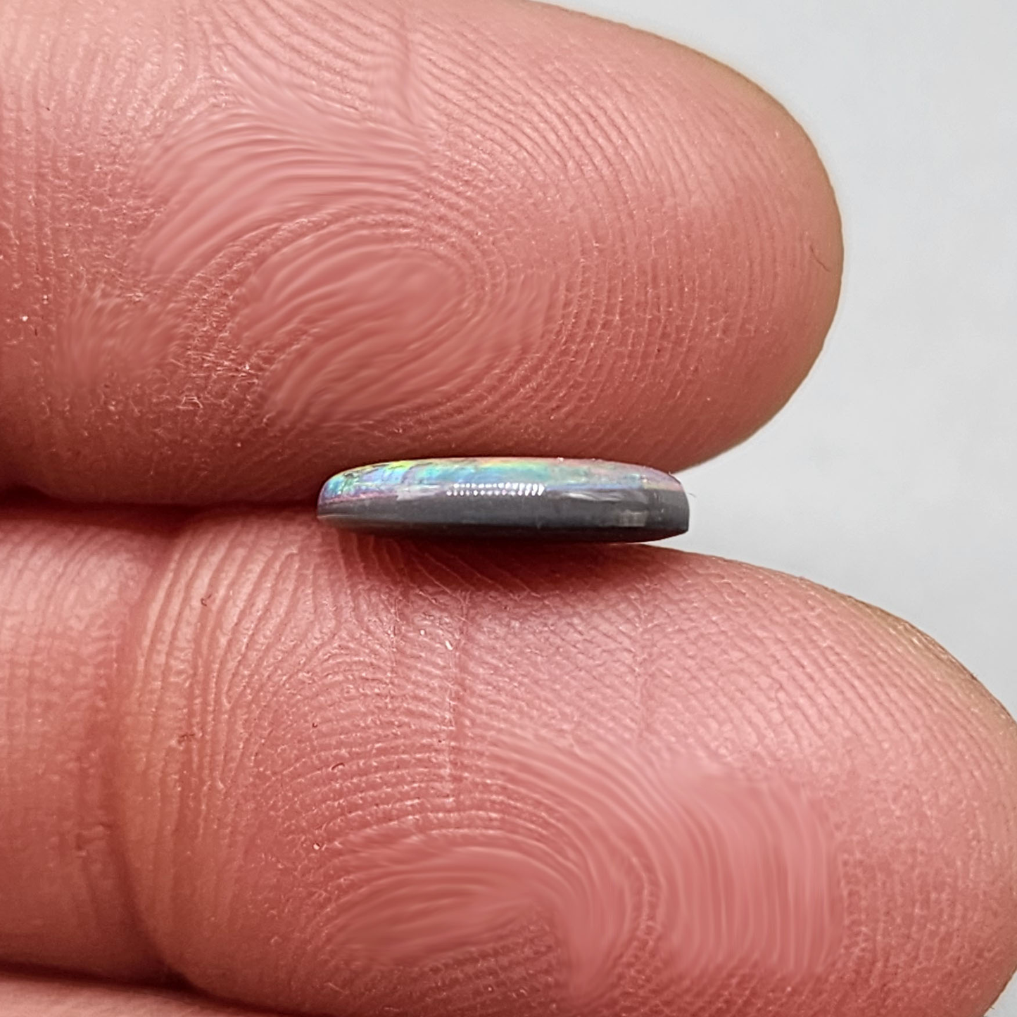 1.5cts Dark Opal with vivid pinkls and flecks of green