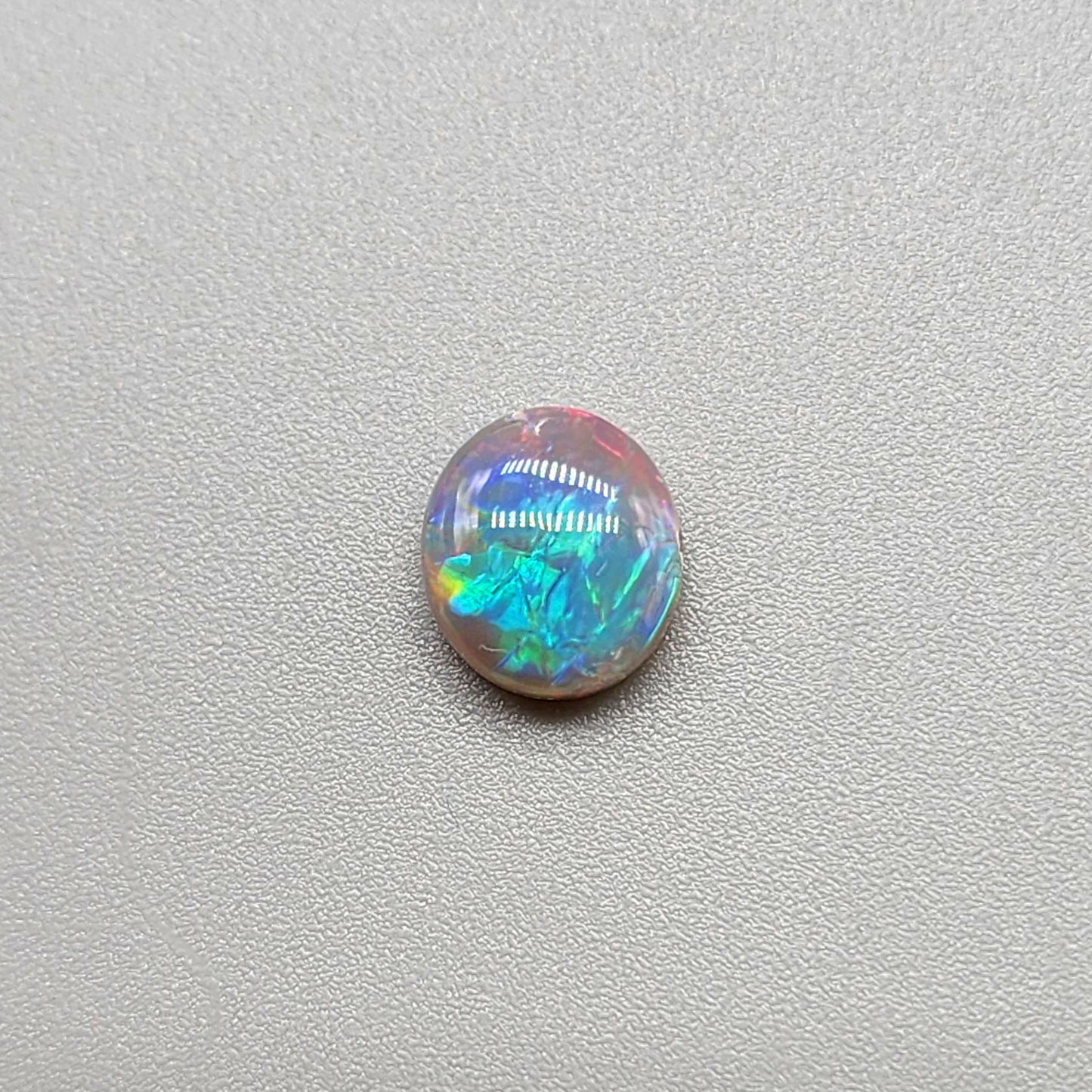 1.25cts  Dark Opal with vivid multi color pastel color palette