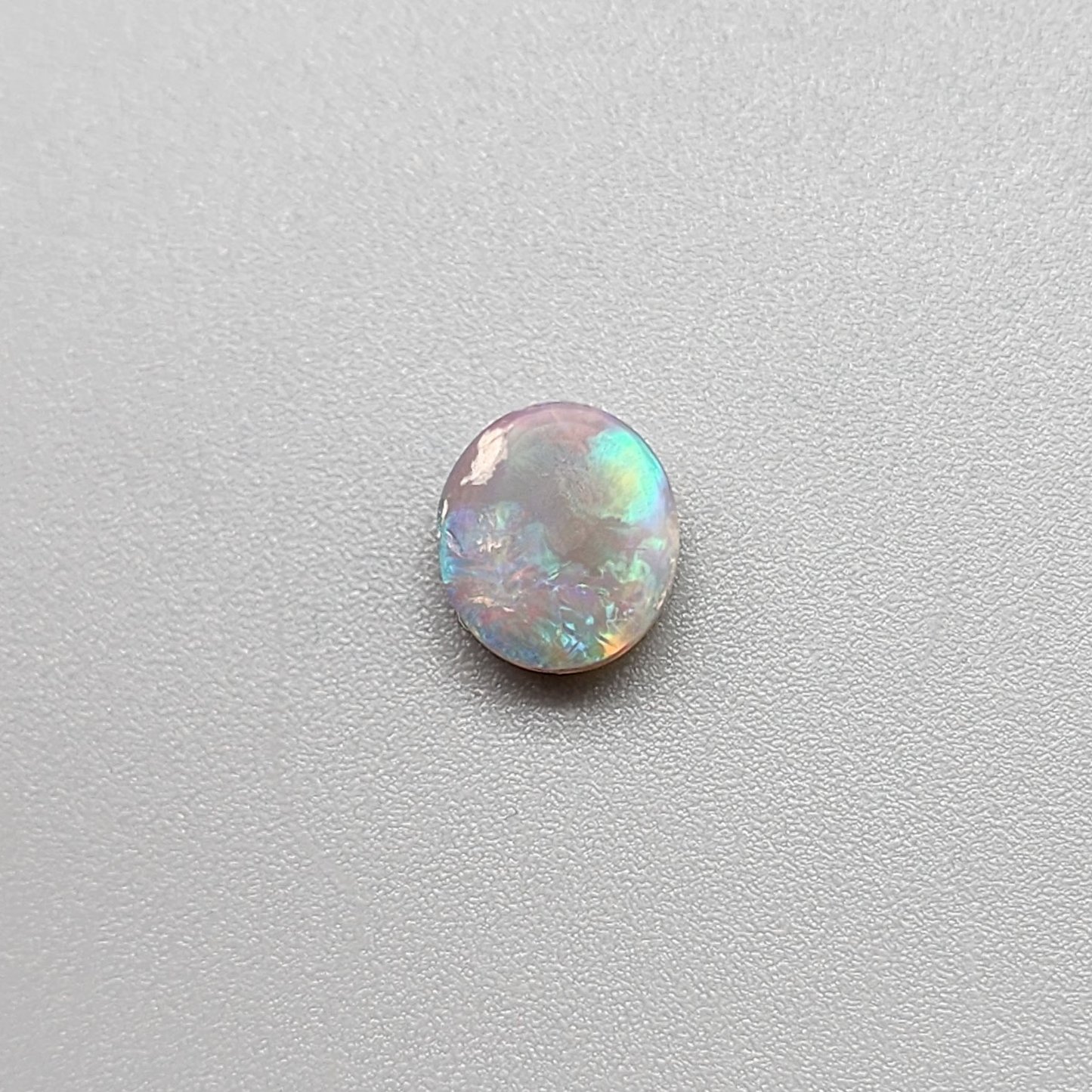 1.25cts  Dark Opal with vivid multi color pastel color palette