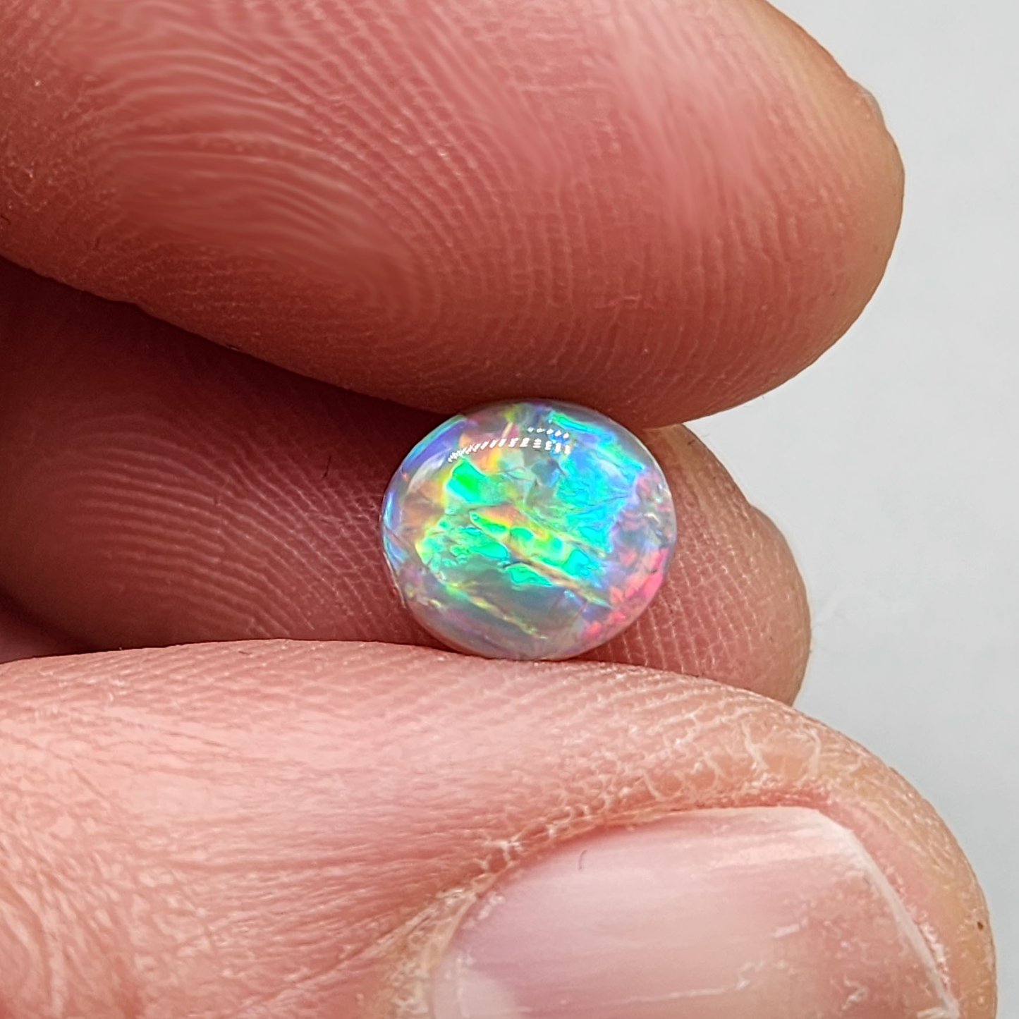 1.25cts  Dark Opal with vivid multi color pastel color palette