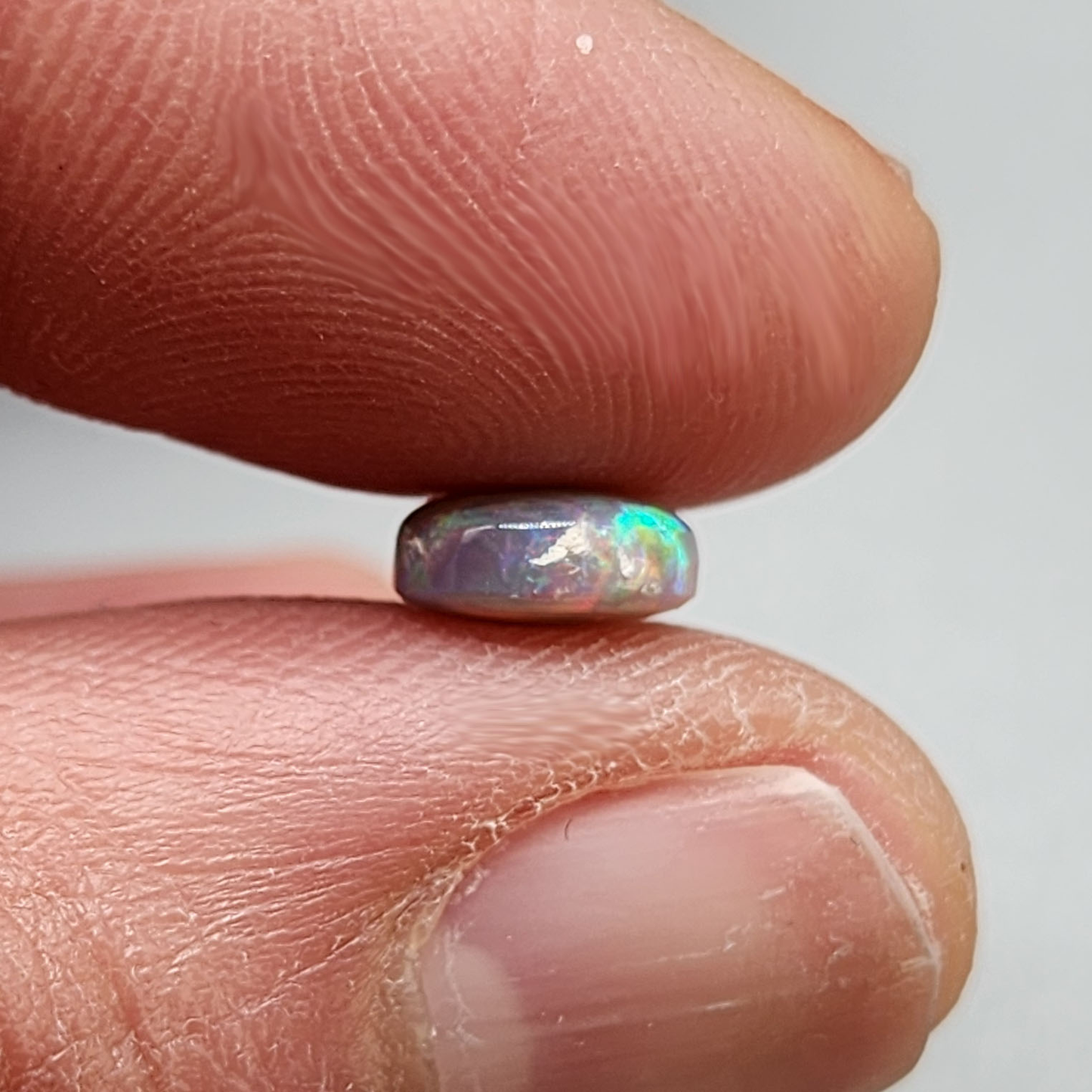 1.25cts  Dark Opal with vivid multi color pastel color palette