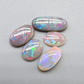 Assorted Black and Dark opals with pastel color palettes