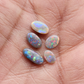 Assorted Black and Dark opals with pastel color palettes