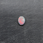 Black opal with bright pink small fire pattern and hints of blue and green