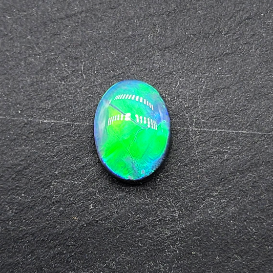 Museum grade Black opal with blindingly bright, green broadflash pattern