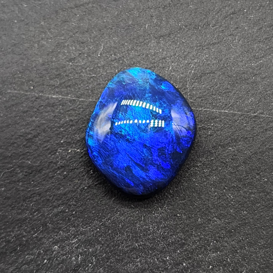 Gem black opal with dence patterning. this stone exhibits a lovely blue ombre effect with movement