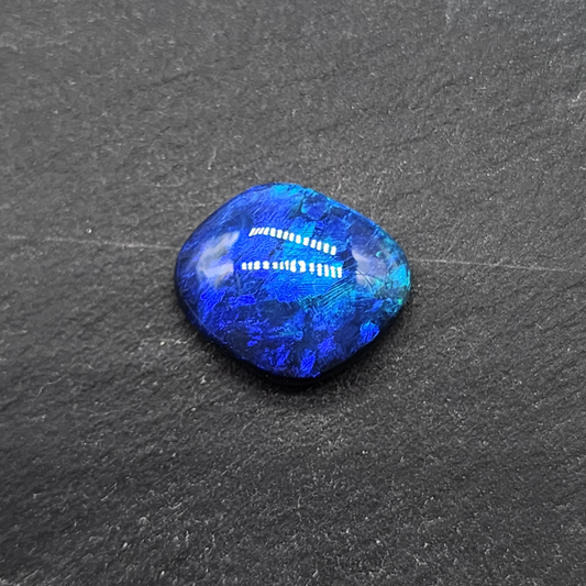 Gem black opal with dence patterning. this stone exhibits a lovely blue ombre effect with movement