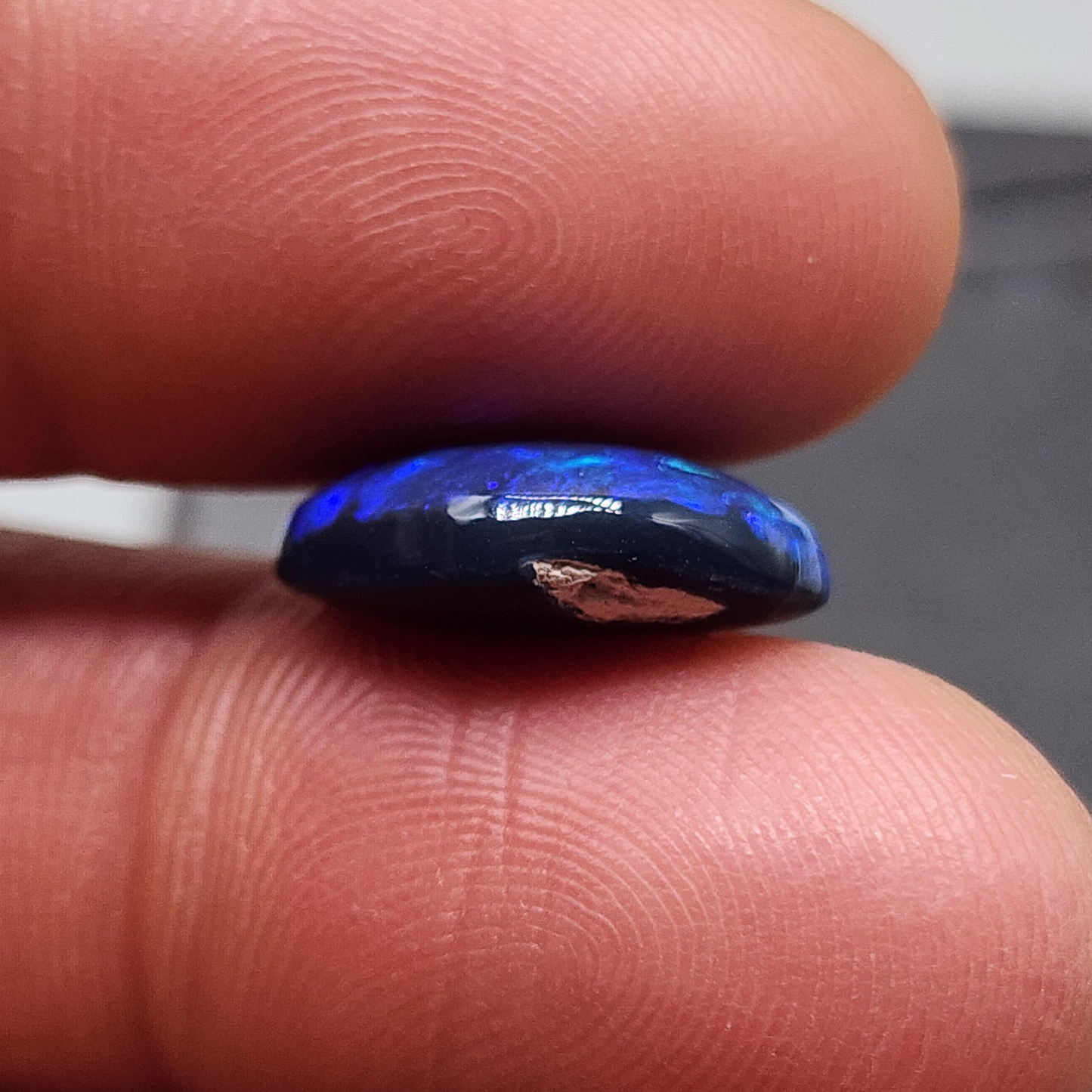 Gem black opal with dence patterning. this stone exhibits a lovely blue ombre effect with movement