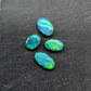 Black Opals with vivid green-blue color play and mossy patterns