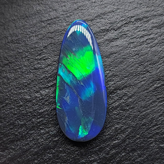 Large Museum grade black opal with brilliant, green/blue feather pattern