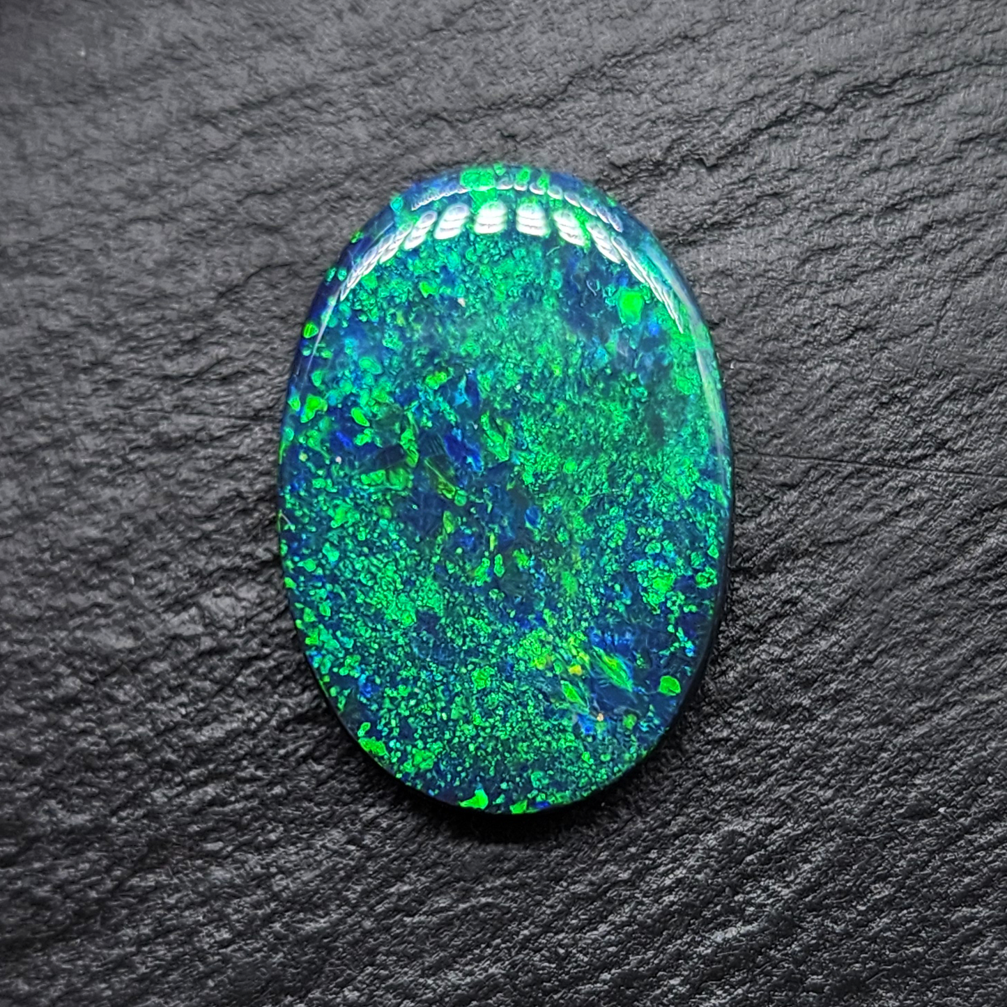 Large Museum grade black opal with a mossy, green-blue pinfire pattern